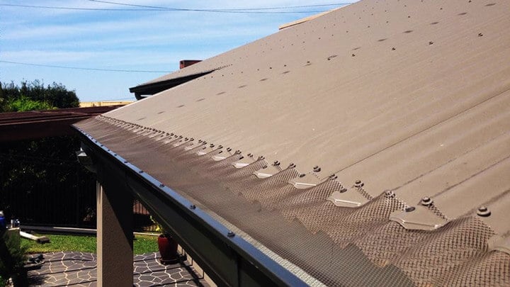 gutter installation completed on brown roofed house - gutters Toowoomba