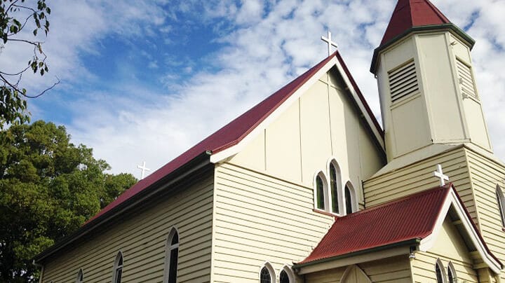 front view of white church with red roof - roofing Toowoomba