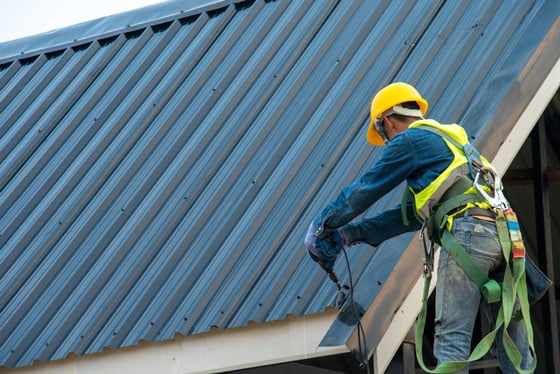 Roofer Installing Metal Roof