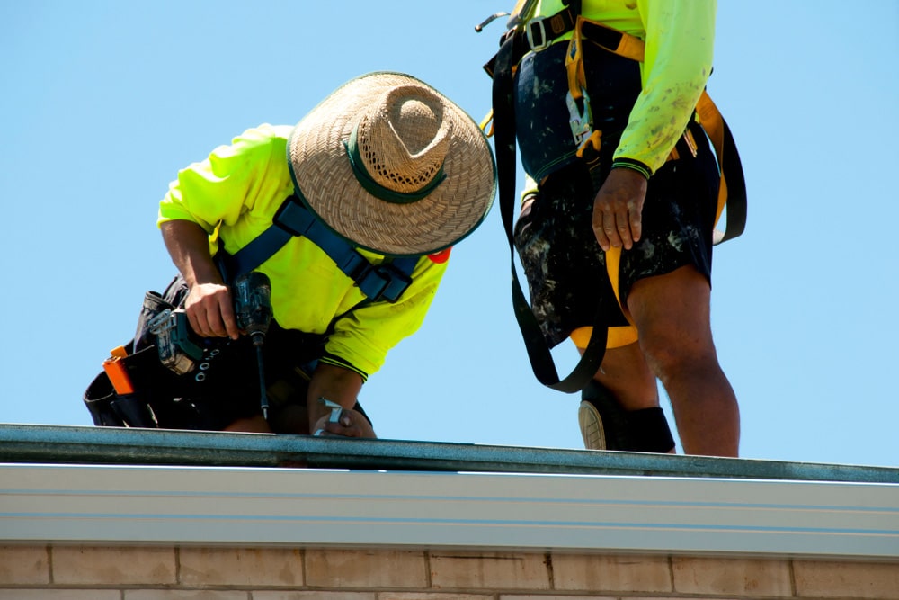 Roofer Repairing Leaking Roof